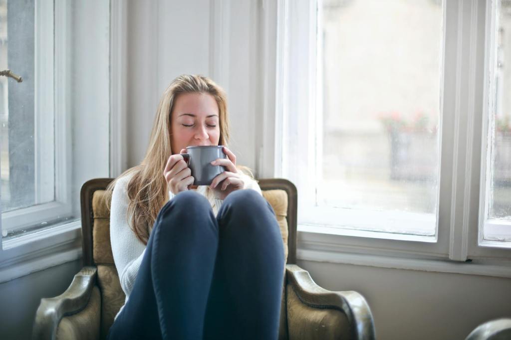 A British woman living in the US drinking a cozy cup of tea, one of the main things Brits miss from home.